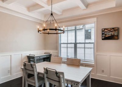 dining room with wagon wheel chandelier